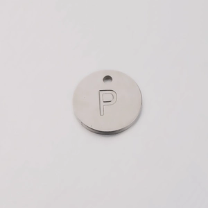 Macro view of mirror polished stainless steel 12mm round charm with letter P cutout