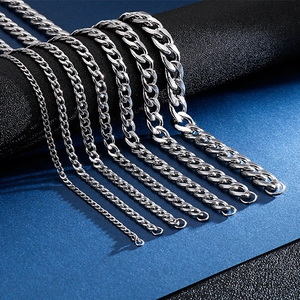 Macro detail of various widths and sizes of silver stainless steel NK chain necklaces