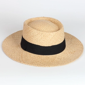Classic straw boater hat for women with wide black ribbon trim on white background