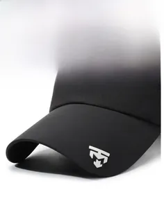 Detailed close-up of a black baseball cap brim with metallic logo and sturdy fabric