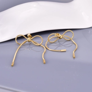 18K gold bow tassel earrings with snake chain design for a modern minimalist look