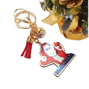 Creative DJ Santa Claus keychain with red tassel and transparent star pendant gift