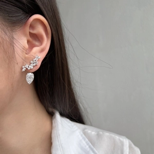 Luxurious S925 silver stud earrings with teardrop zircon on a model for a refined look