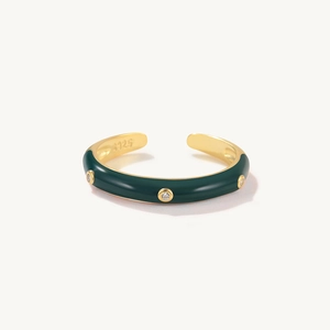 Detailed macro view of S925 engraved stamp inside green enamel zircon open ring