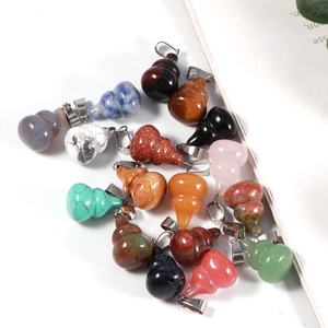 Detailed close-up of colorful gourd-shaped natural stone pendants with metal clasps