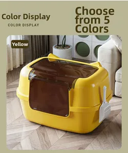 Detail view of large yellow cat litter box with transparent door and hanging white scoop