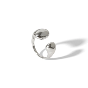 Macro detail of silver asymmetric open ring with high-polished mirror finish surface