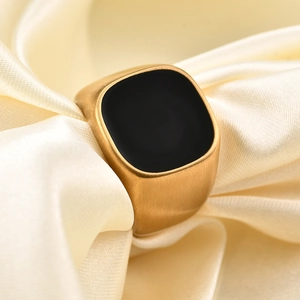 Minimalist 18K gold-plated brushed metal ring with black square enamel on beige silk