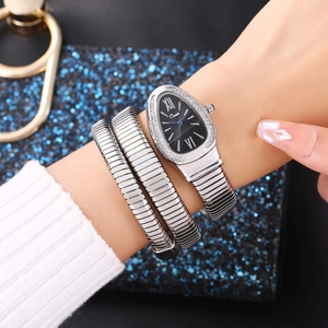 Silver snake-style wrap watch with a teardrop dial and pavé crystal bezel for women