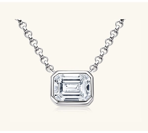 Detailed close-up of emerald-cut gemstone necklace in S925 sterling silver bezel setting
