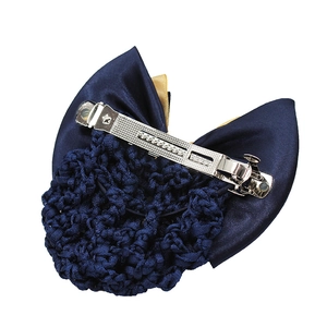 Detail of the navy blue satin bow hair clip with mesh net and silver spring fastener
