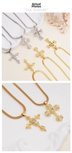 Macro view of vintage cross pendants with zircon inlays and flat snake chains