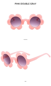 Detailed views of pink flower shaped kids sunglasses with double gray gradient lenses