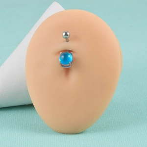 Macro detail of 14G surgical steel belly ring with clear blue stone and prong setting