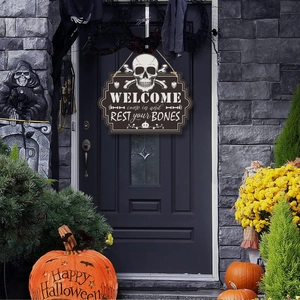 Halloween skeleton door sign with Welcome Come In And Rest Your Bones text on black door