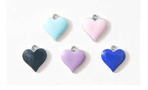 Close-up of colorful heart charms with gold edges for DIY necklace and bracelet making