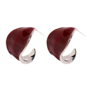 Elegant deep red enamel C-shape leaf earrings with silver metal finish on white background