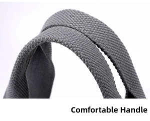Detailed close-up of grey woven canvas tote bag handles with reinforced stitching