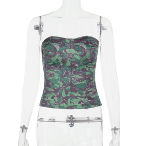 Detailed close-up of a floral print corset top with green and purple leaf patterns