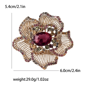 Detailed view of floral brooch with purple rhinestones and size dimensions in cm and inches