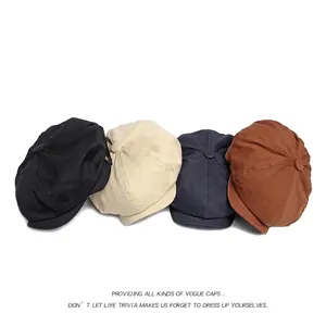 Adjustable newsboy caps in black, beige, navy, and brown with classic metal rivet detail