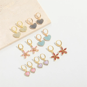 Gold hoop earrings with heart and flower pendants featuring colorful zircon evil eye designs