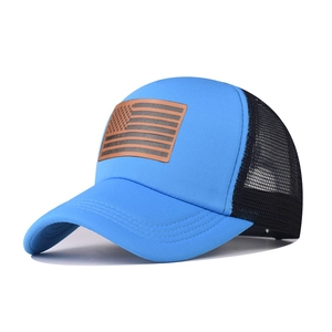Blue and black American flag trucker hat with breathable mesh and brown leather patch