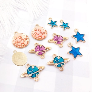 Astronaut theme enamel alloy charms featuring blue and pink stars and planets for DIY jewelry