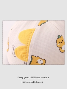 Detailed view of the soft waffle fabric and cute yellow dinosaur on the baby sun hat
