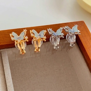 18k gold plated butterfly ear clips with translucent blue wings and zircon accents