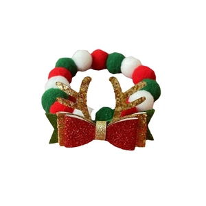 Christmas pet collar with red and green plush balls, gold antlers and a glittery bow