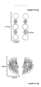 Detailed tile display of silver stainless steel earrings with size and weight metrics