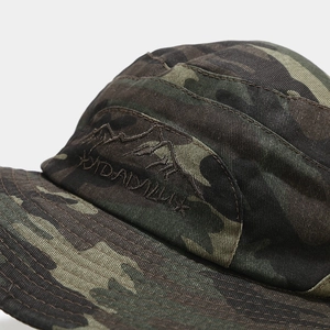 Detail of jungle camo five-panel cap featuring mountain embroidery and durable stitching
