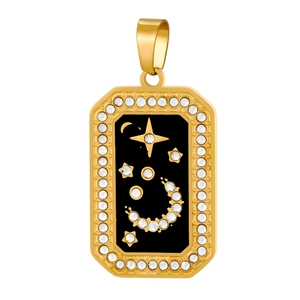 Detail of gold moon and star pendant with black enamel inlay and sparkling crystals