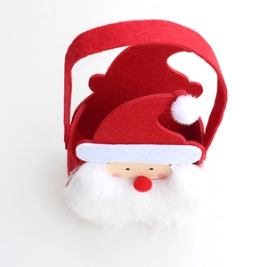 Detailed view of red and white Santa Claus felt gift bag with sturdy handles