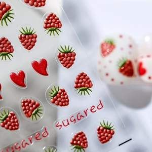 3D sugared nail art stickers featuring red raspberry and heart designs for manicure