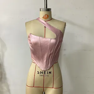 Detail of pink satin one-shoulder camisole with corset boning and silk glossy finish