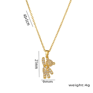 Golden bear pendant necklace for women with white pavé-set gemstones on a polished chain