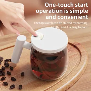 Electric self-stirring glass coffee mug with white ergonomic handle and top button switch