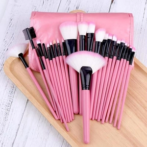 Professional 24-piece pink makeup brush set with gradient bristles and foldable storage case