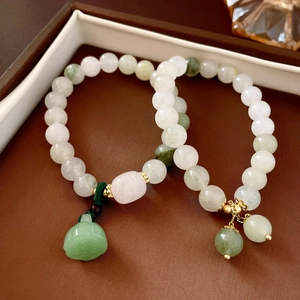 Elegant jade bead bracelets with lotus seed pod and gourd pendants in green and white