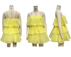 Three-view display of a bright yellow tiered tulle strapless backless cake dress