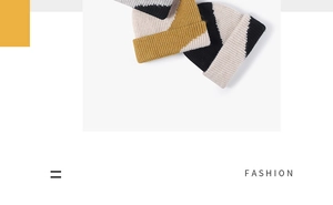 Close-up of color-blocked ribbed knit texture on thick winter beanie hat in yellow and beige