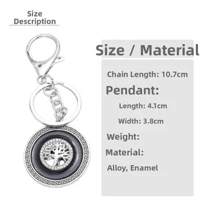 Detail showing life tree keychain dimensions and silver alloy construction with Greek fret