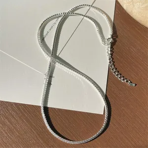 Macro detail of 925 sterling silver tennis necklace with sparkling cubic zirconia stones