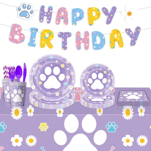 Dog paw party supplies set with Happy Birthday banner and purple tableware for pet birthdays