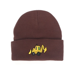 Close-up of the detailed yellow excavator embroidery on a brown knit winter beanie