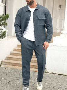 Detail of dark grey textured corduroy long sleeve shirt and jogger pants for men