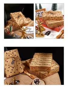 Detail of red foil Christmas wrapping paper with kraft gift tags and natural jute twine