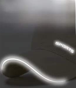 Detail of grey mesh sports cap featuring reflective logo and brim for night safety